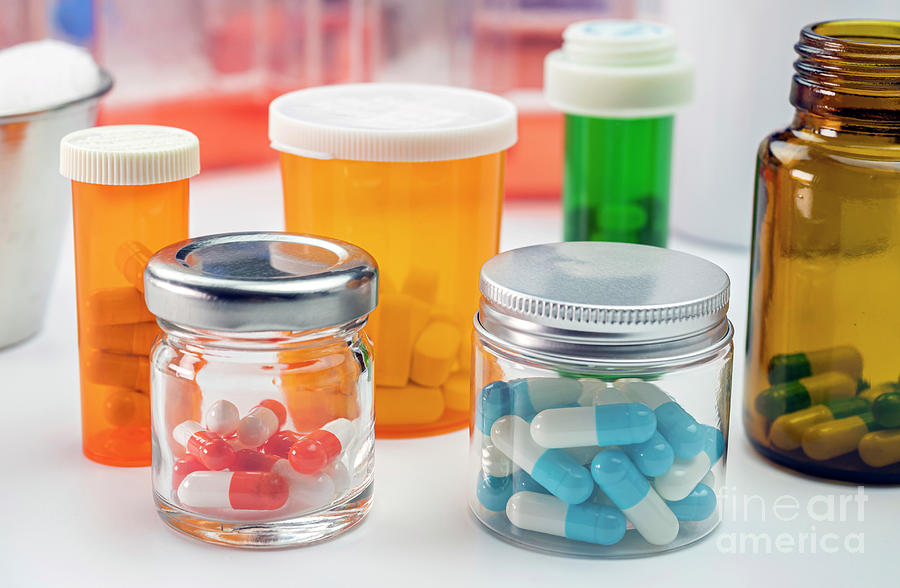 Jars Containing Different Types Of Pills Photograph by Digicomphoto/science Photo Library