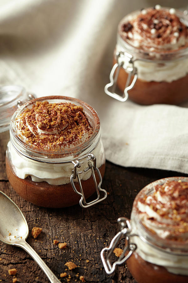Jars Of Chocolate Mousse With Whipped Cream Topped With Cocoa And Spicy Biscuit Crumbs Photograph by Lukam