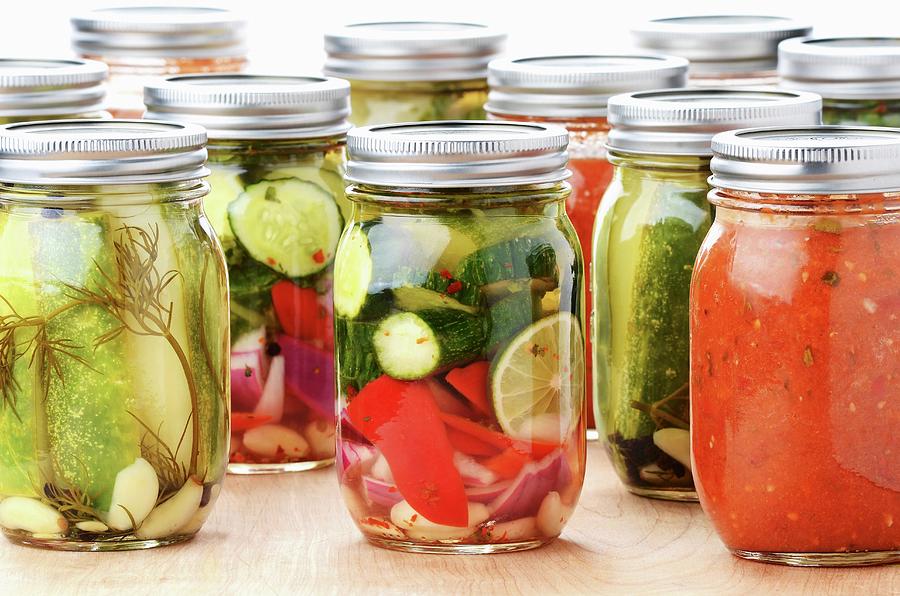 Jars Of Mediterranean Preserved Vegetables: Cucumber, Courgettes, Pepper, Onion, Lemon And Tomato Sauce Photograph by Brian Enright