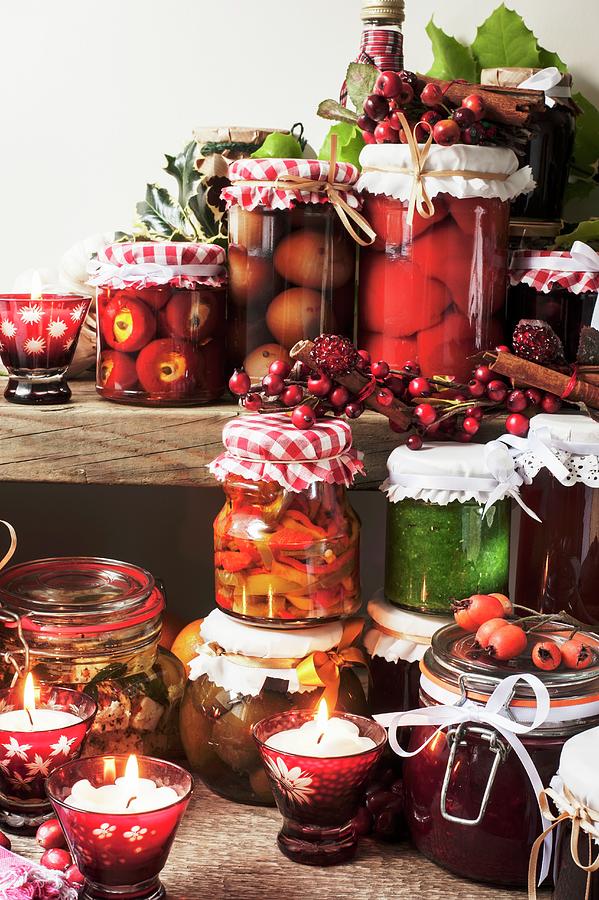 Jars Of Pickled Peppers, Onions, Preserved Figs, Pesto And Medlar Jelly On A Wall Shelf For Christmas Photograph by Linda Burgess
