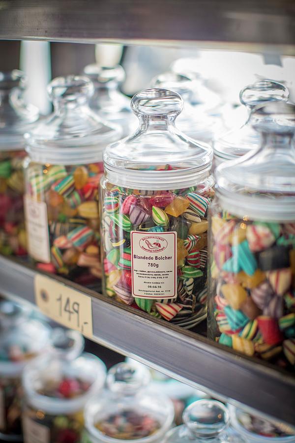 Jars Of Sweets At The Torvehallerne Market In Copenhagen Photograph by Anne Faber