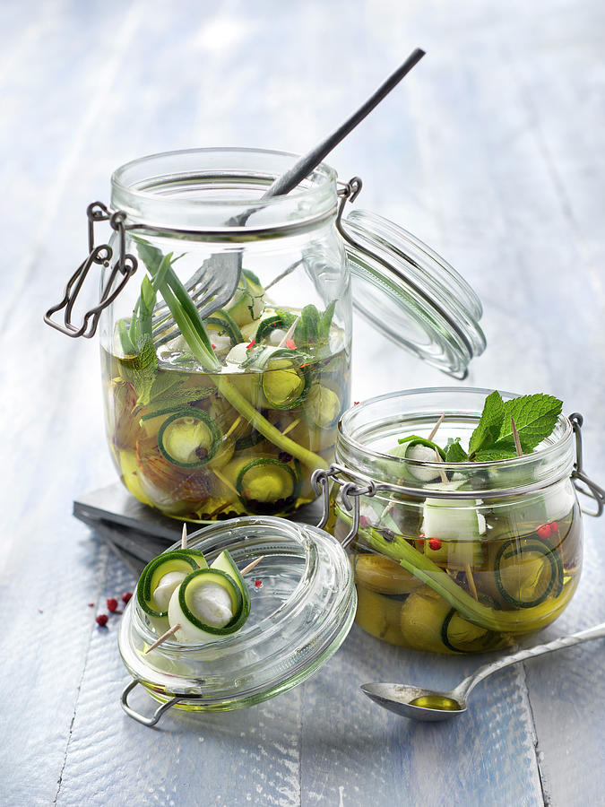 Jars Of Zucchinis And Mozzarella Marinated In Oil With Spring Onions And Mint Photograph by Studio