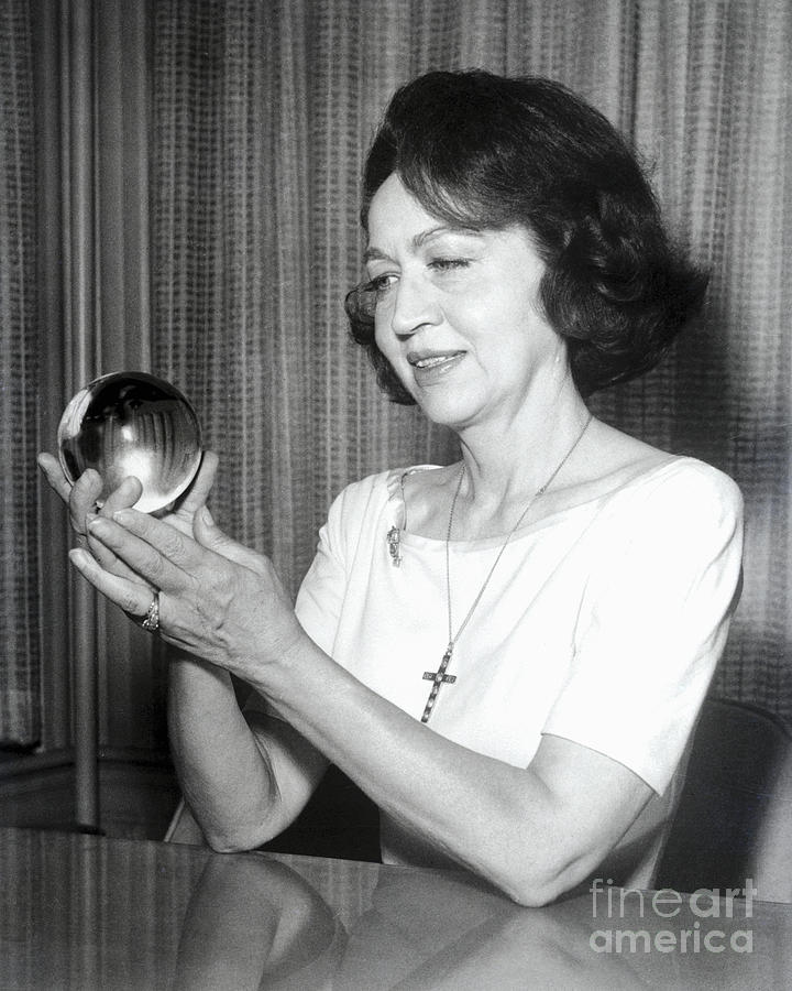 Jeane Dixon Holding A Crystal Ball Photograph by Bettmann