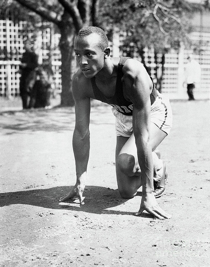 Jesse Owens Crouching At Workout Start Photograph by Bettmann