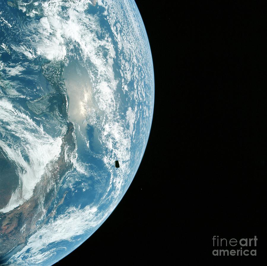 Jettisoned Apollo 12 Spacecraft Part Against The Earth Photograph by Nasa/science Photo Library