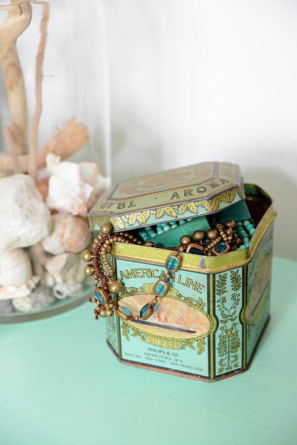 Jewellery In Tin And Collection Of Seashells In Glass Container Photograph by Revier 51