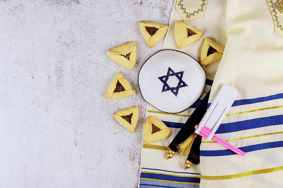 Cookie Photograph - Jewish Carnival Purim Celebration On Hamantaschen Cookies, Noisemaker And Mask With Parchment by Cavan Images