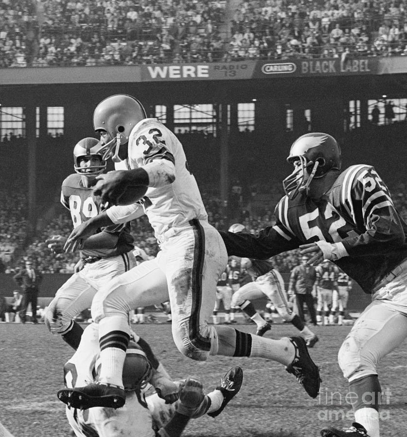 Jim Brown Leaping Over Gene Hickerson Photograph by Bettmann Jim Brown Leaping Over Gene Hickerson Photograph by Bettmann