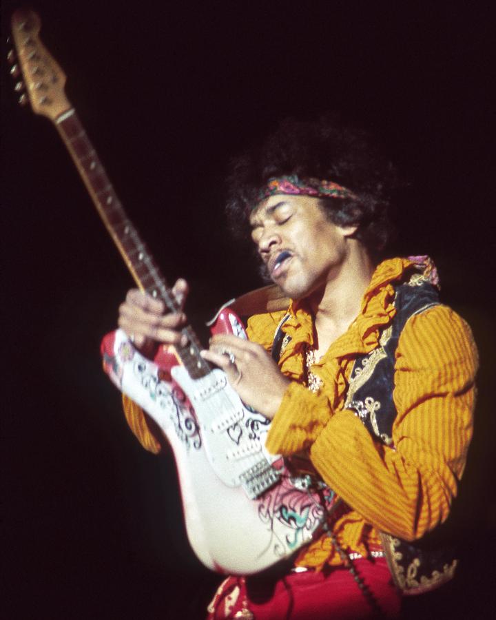 Jimi Hendrix Photograph - Jimi Hendrix Playing With Pick In Mouth At Monterey International Pop Festival by Globe Photos