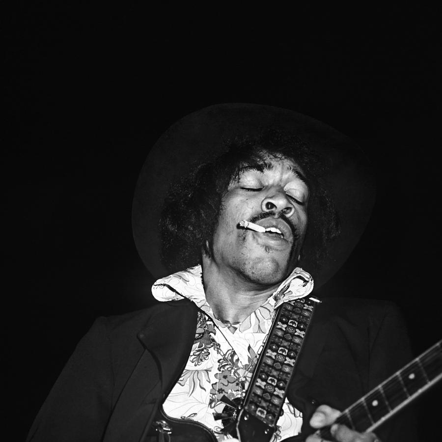 Jimi Hendrix Photograph - Jimi Hendrix Smoking On Stage by Globe Photos