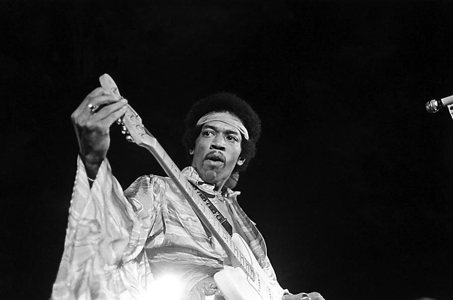 Jimi Hendrix Photograph - Jimi Hendrix Tuning Guitar On Stage by Globe Photos