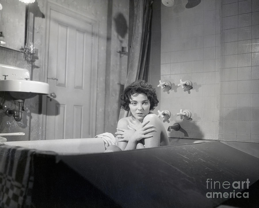 Joan Collins Covering Chest In Bathtub Photograph by Bettmann