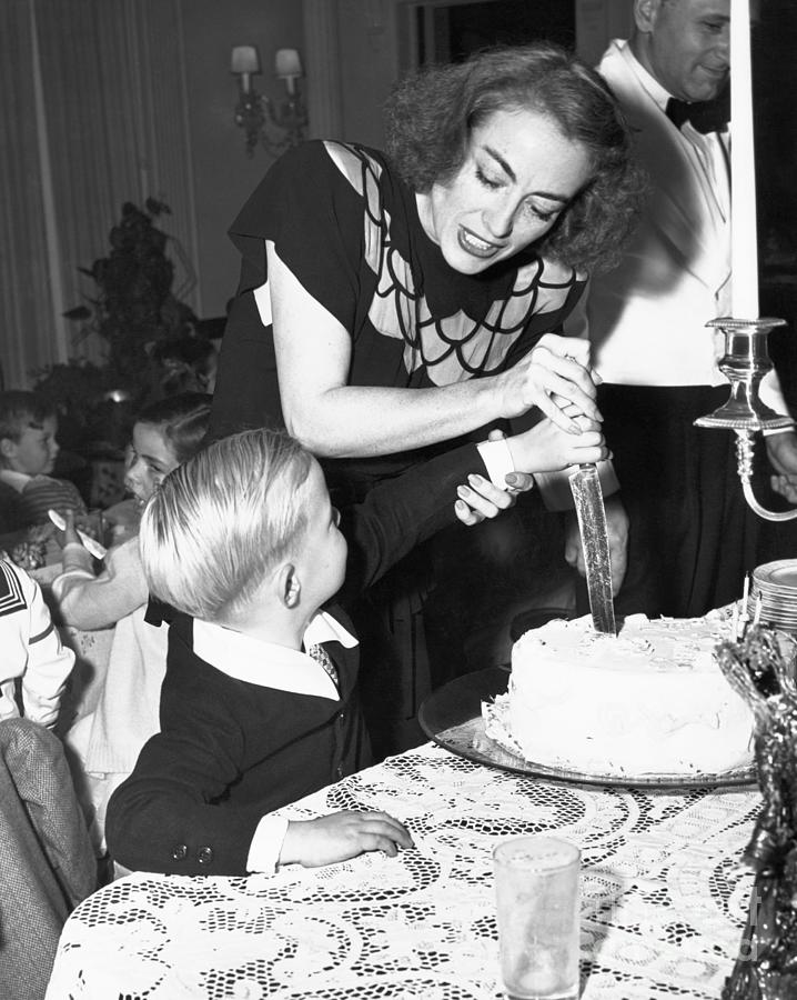 Joan Crawford Helping Son Cut Birthday Photograph by Bettmann