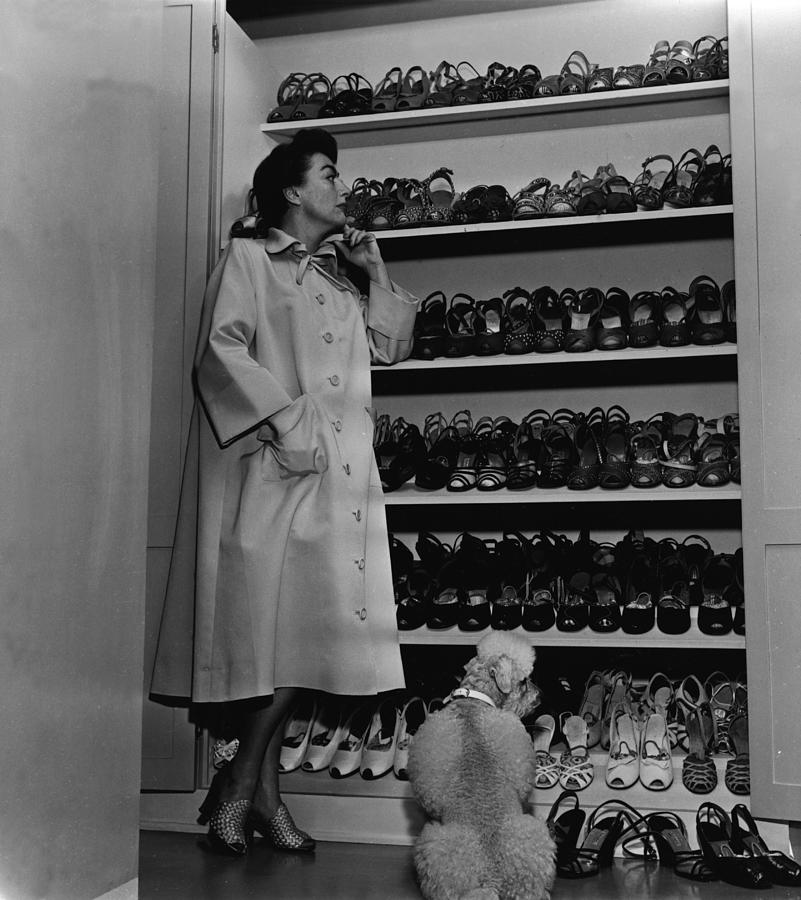 Joan Crawford Inspects Her Shoe Closet Photograph by Hulton Archive