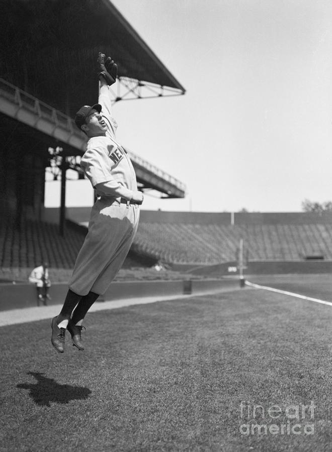 Joe Dimaggio Jumping To Catch Baseball Photograph by Bettmann
