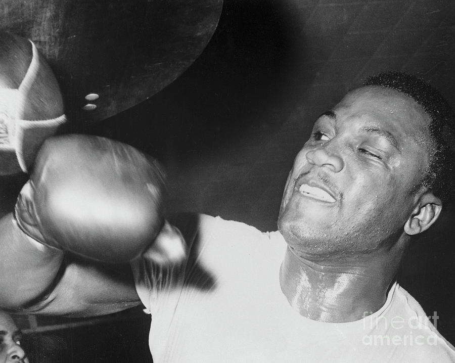 Joe Frazier Working Out With Punching Photograph by Bettmann