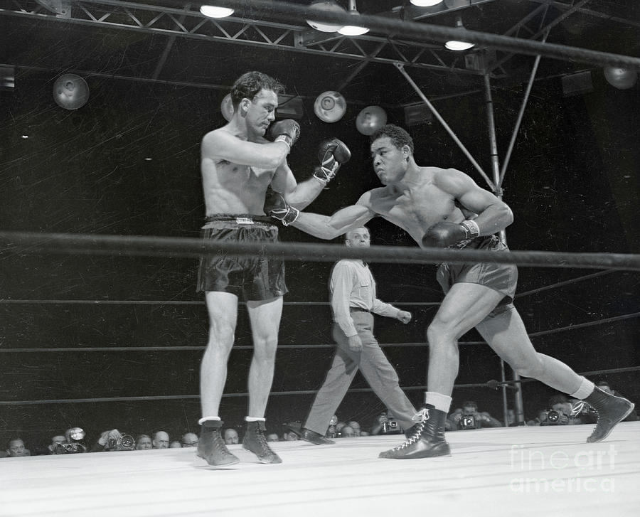 Joe Louis Punching Billy Conn Photograph by Bettmann