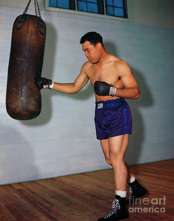 Joe Louis Punching Heavy Bag Photograph by Bettmann