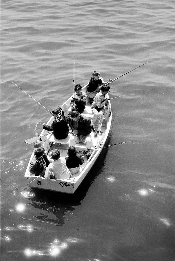 Archival Photograph - Joe Powers fishing w. eight of his ten children in a rowboat on Long Island Sound. by Yale Joel