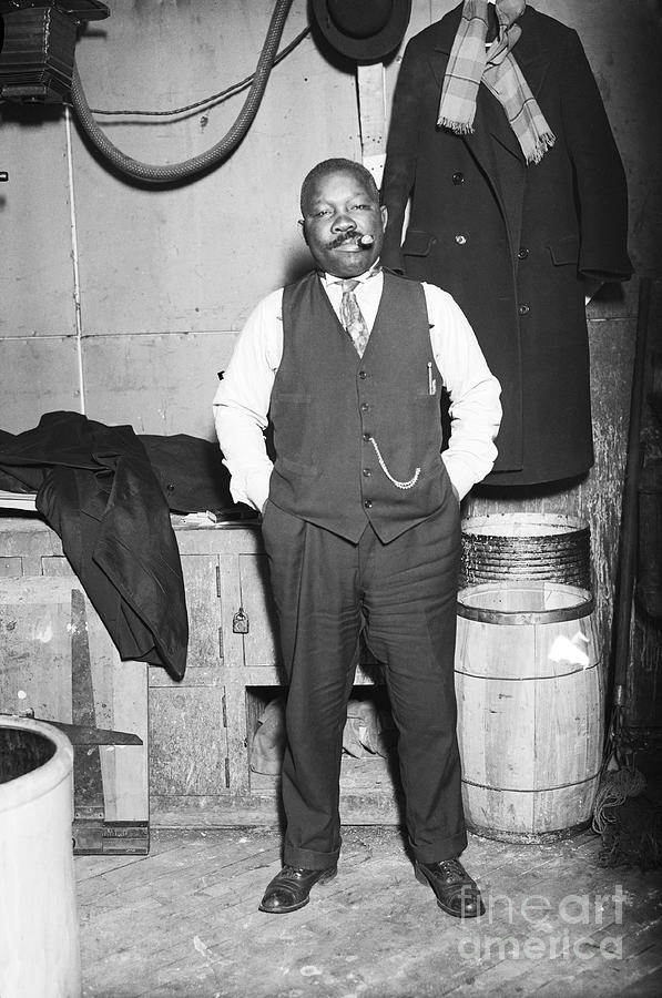 Joe Walcott Standing, Smoking Cigar Photograph by Bettmann