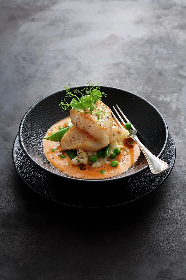 John Dory With Lobster Bisque On A Bed Of Risotto With Peas And