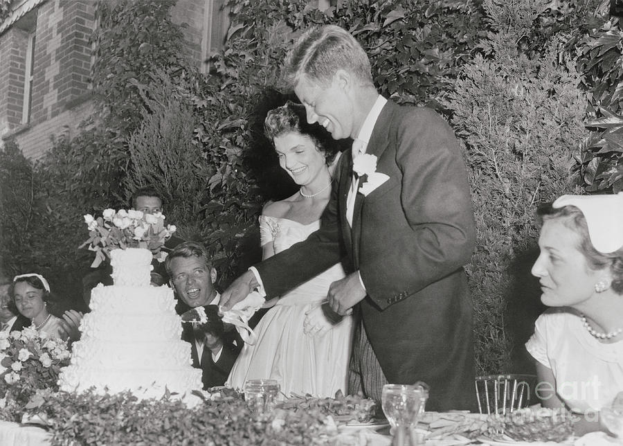 John F. Kennedy And Wife Cutting Cake by Bettmann
