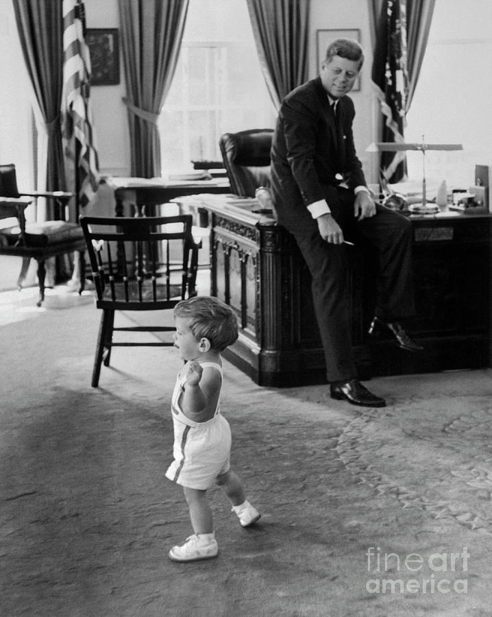 John F Kennedy Photograph - John F Kennedy With 18 Month Old Son by Bettmann