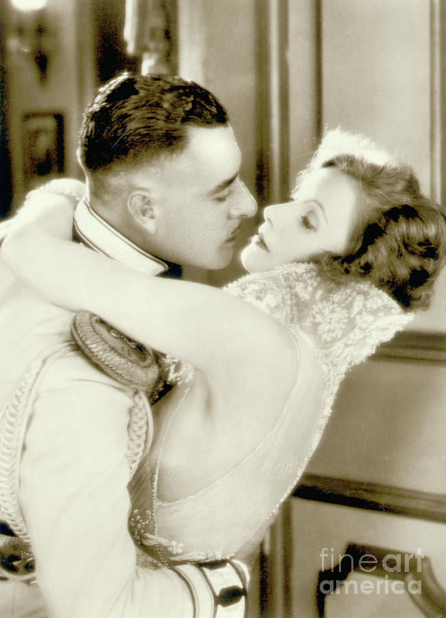 John Gilbert Embracing Greta Garbo Photograph by Bettmann