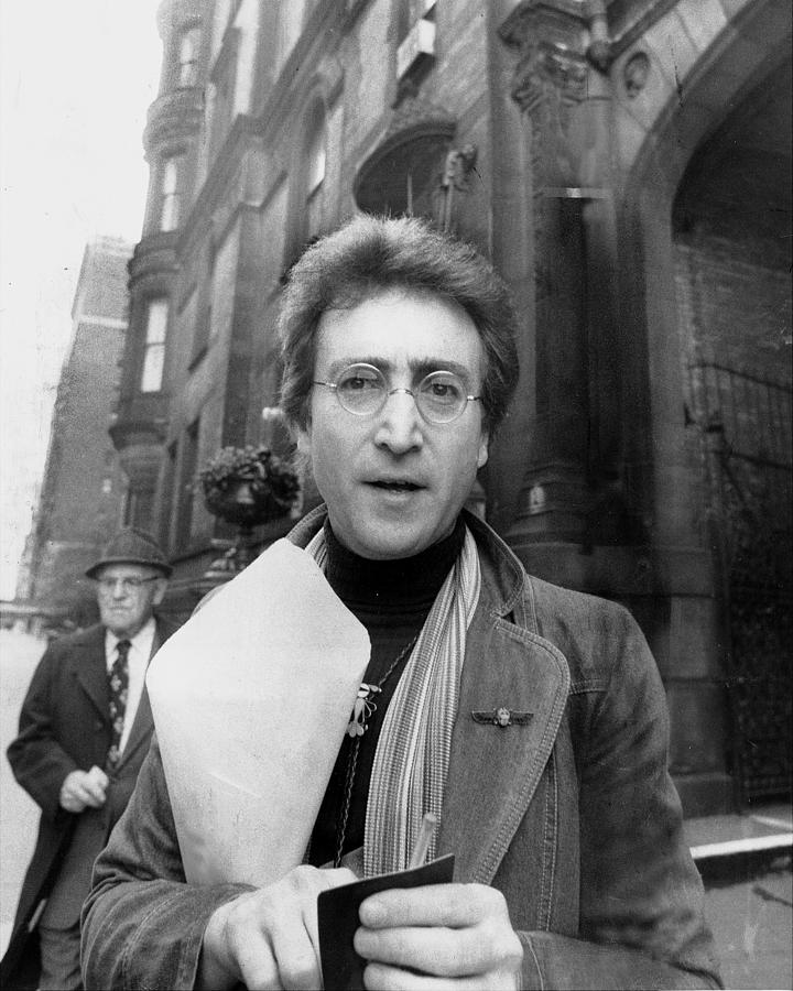 John Lennon Returning From Florist Shop Photograph by New York Daily News Archive