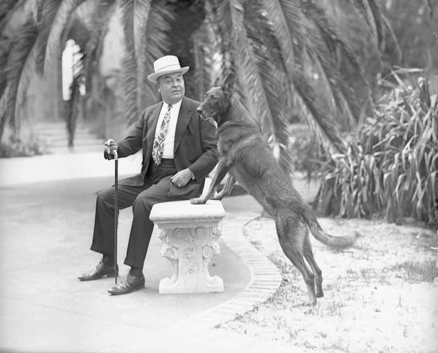 John Ringling Sitting On Bench With Dog Photograph by Bettmann