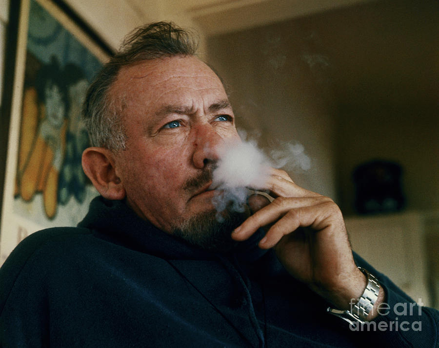 John Steinbeck Smoking Cigarette Photograph by Bettmann
