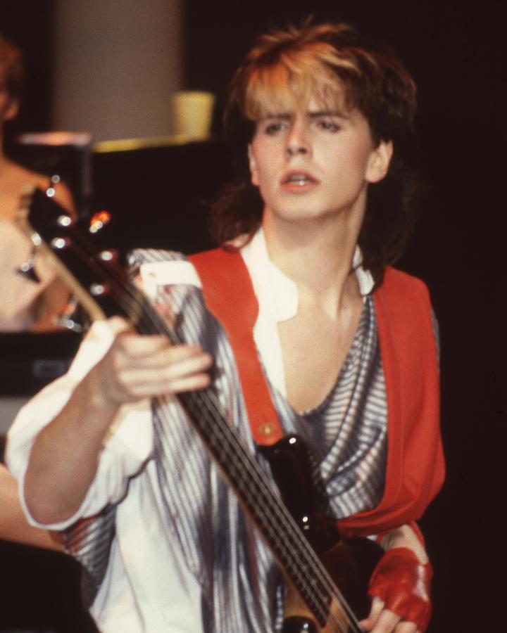 Duran Duran Photograph - John Taylor Playing Guitar In Concert by Globe Photos