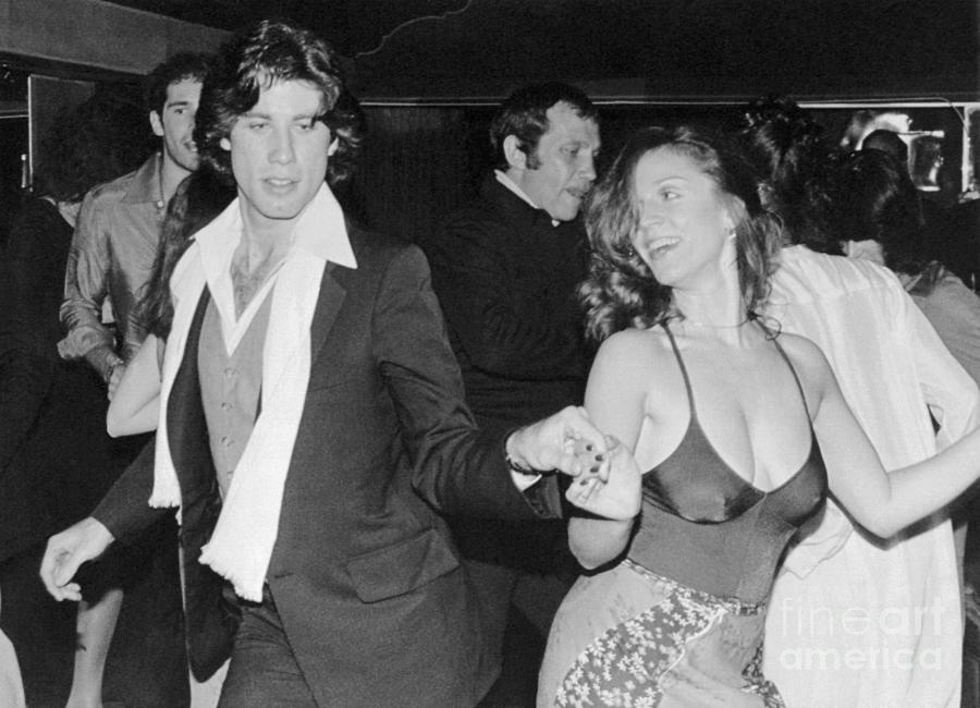 John Travolta Dancing With Actress Photograph by Bettmann