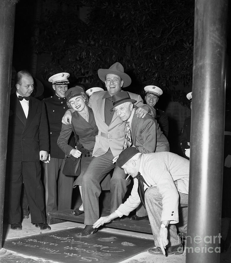 John Wayne Puts His Foot Into Cement by Bettmann