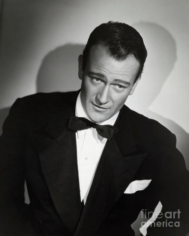 John Wayne Wearing A Tuxedo Photograph by Bettmann
