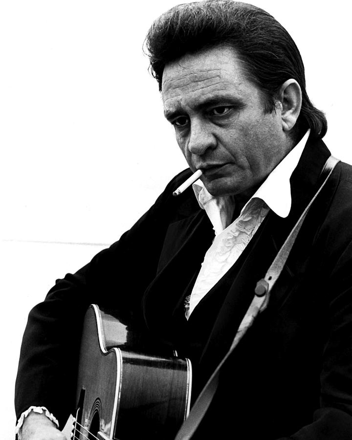 Johnny Cash Photograph - Johnny Cash Playing Guitar And Smoking At Folsom Prison by Globe Photos