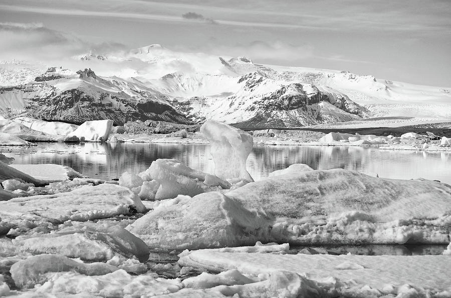Jokulsarlon Glacial Lagoon Icebergs and Volcano Caldera Iceland Black and White Photograph by Shawn OBrien