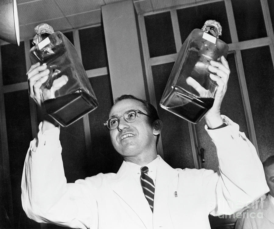 Jonas Salk Holding Bottles Of Polio Photograph by Bettmann Jonas Salk Holding Bottles Of Polio Photograph by Bettmann