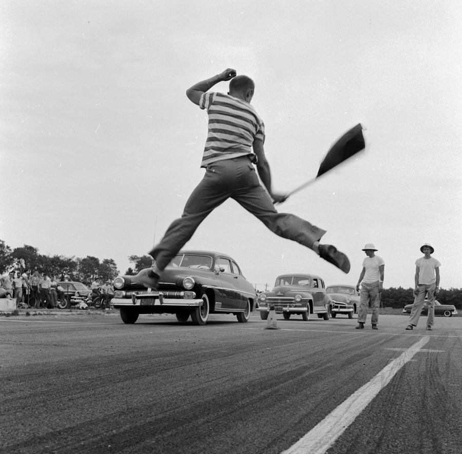 Jumping Flag Man Photograph by Efield
