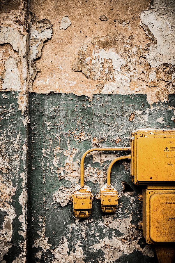 Junction Box And Power Sockets On Wall With Peeling Paint Photograph by Ruud Pos