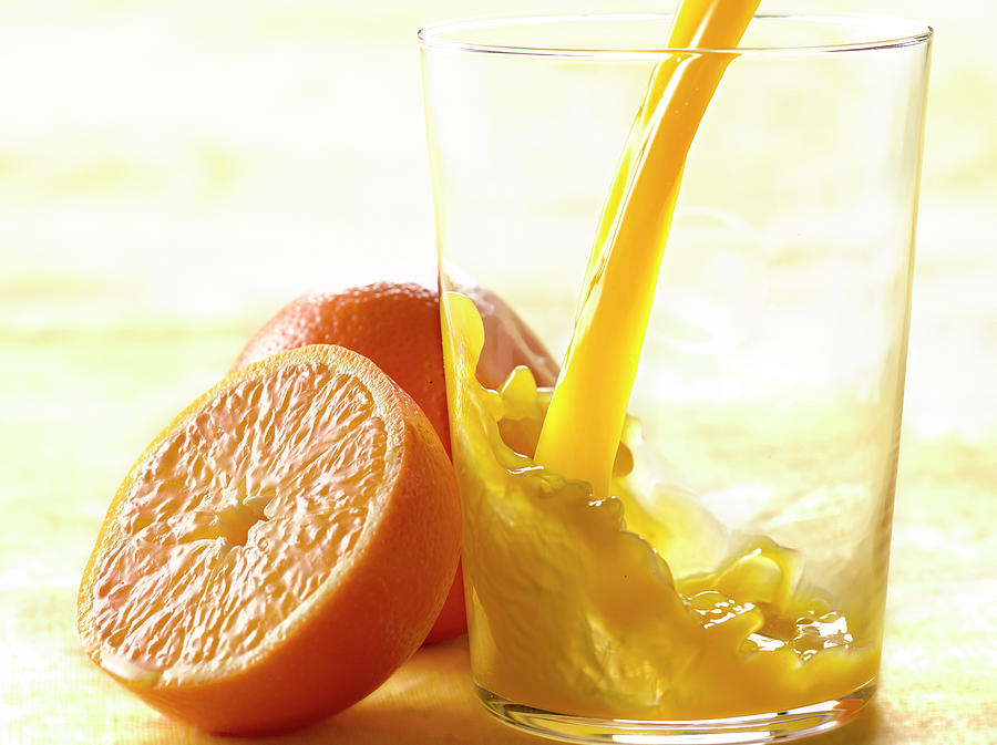 Jus D'orange Pouring A Glass Of Orange Juice Photograph by Studio ...