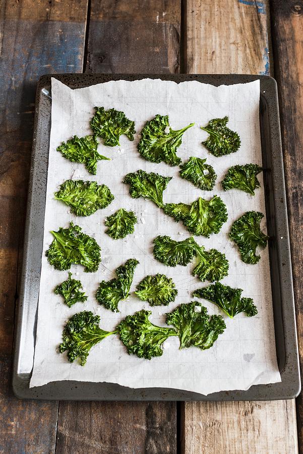 Kale Chips On A Baking Tray Photograph by Hein Van Tonder