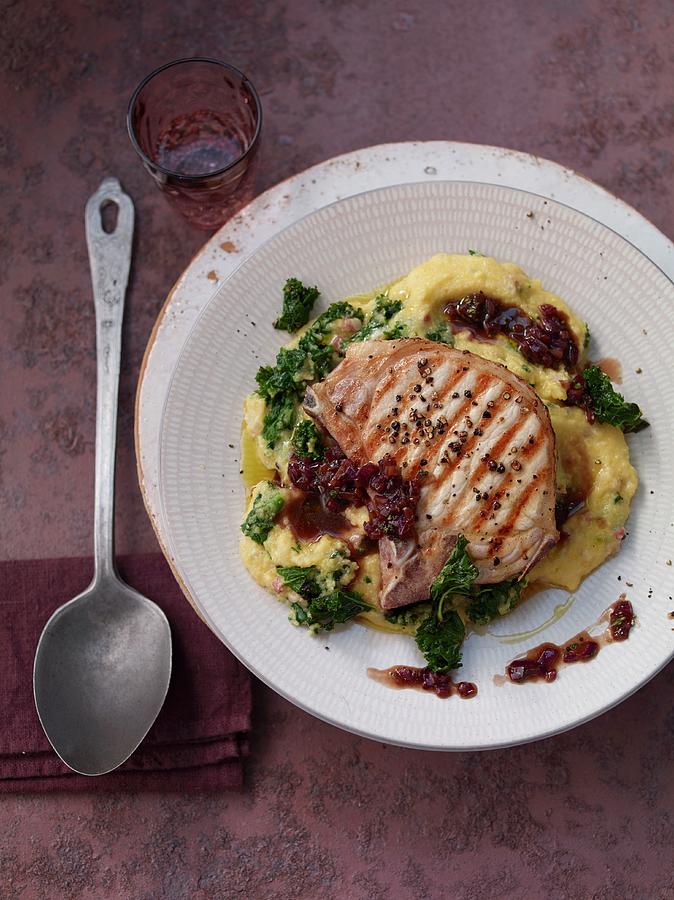 Kale Polenta With A Pork Chop And Red Onions Photograph by Jan-peter Westermann