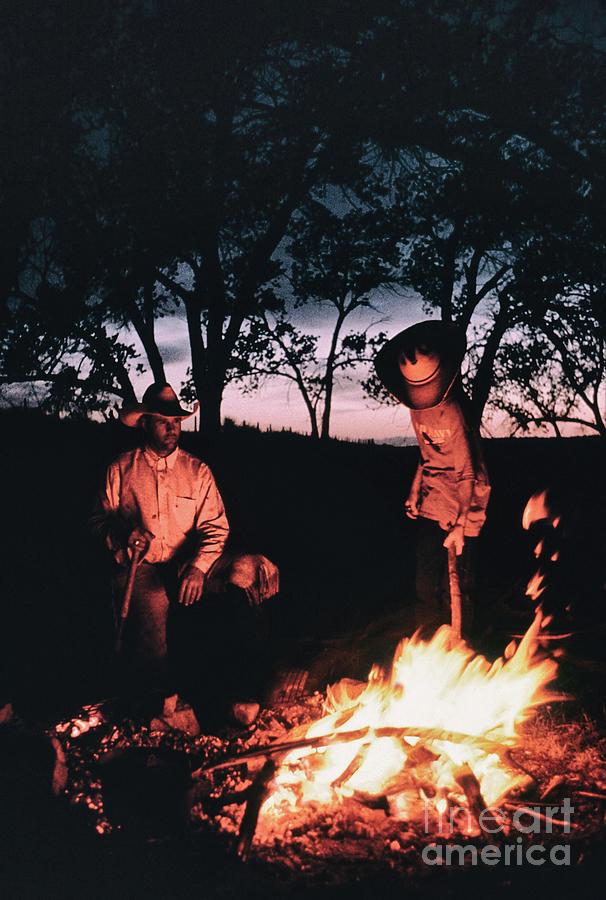 Keeping Warm By The Fire After A Day Branding Cattle On The Vincent ...