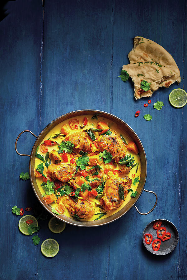 Keralan Style Roast Chicken Curry Served With Naan Bread And Topped With Fresh Chilli And Coriander Photograph by Cliqq Photography
