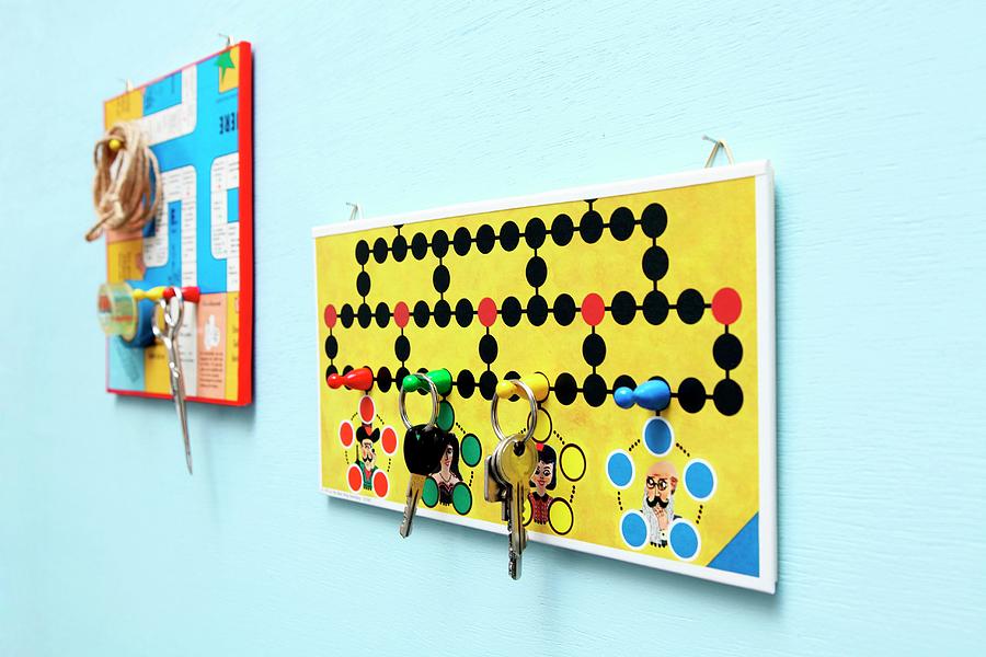 Key Holder And Pin Board Creatively Crafted From Board Games Photograph by Thordis Rggeberg