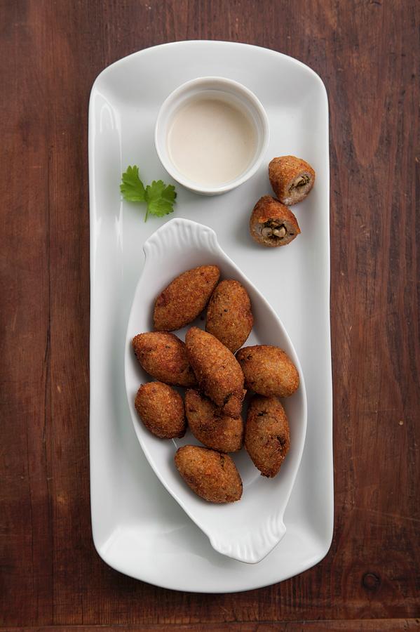 Kibbeh north African Bulgur Dumplings Filled With Nuts, With A Tahini Dressing Photograph by Babicka, Sarka