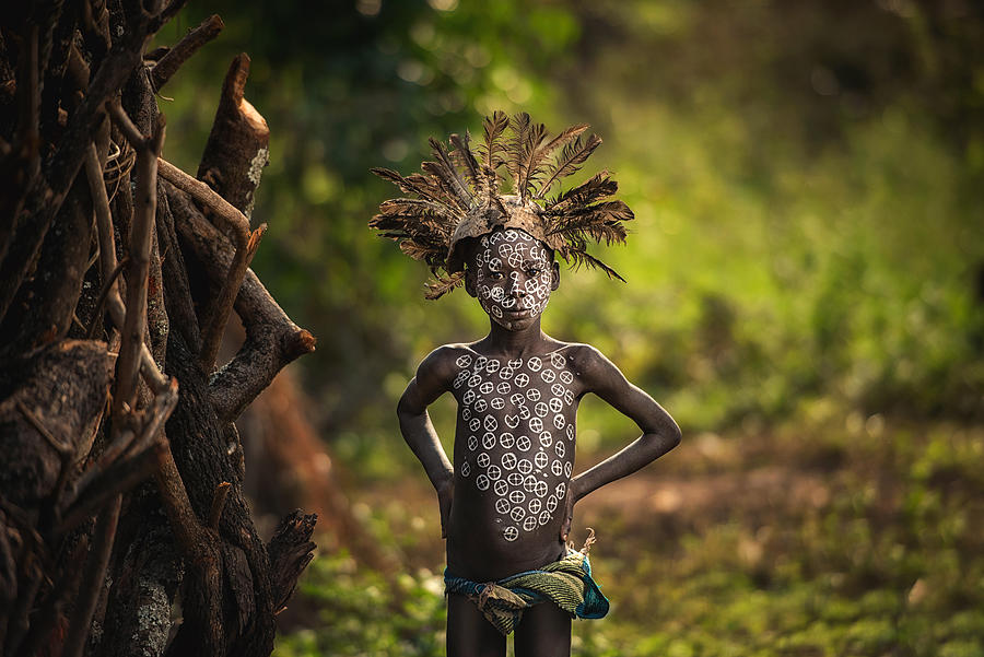 Kibish, Ethiopia - The Boy Suri Tribe With Traditional Dress. Photograph by Chanwit Whanset