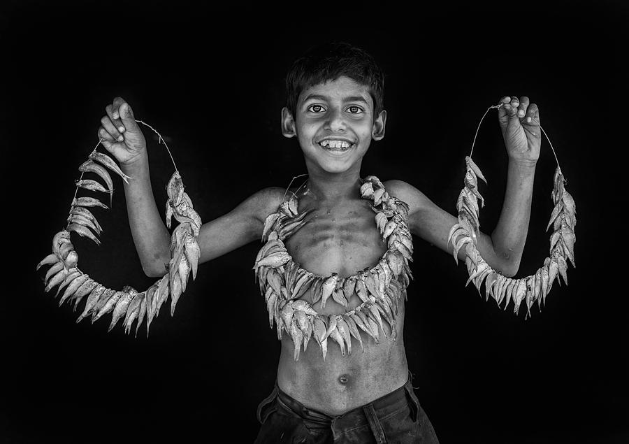 Kid With Fish Photograph by Nilendu Banerjee