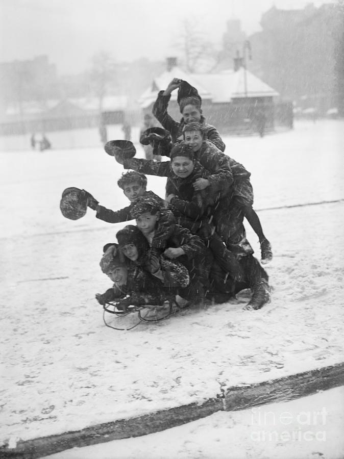 Kids Piled On Sled Snow Storm Photograph by Bettmann